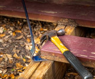 decking boards with hammer and chisel