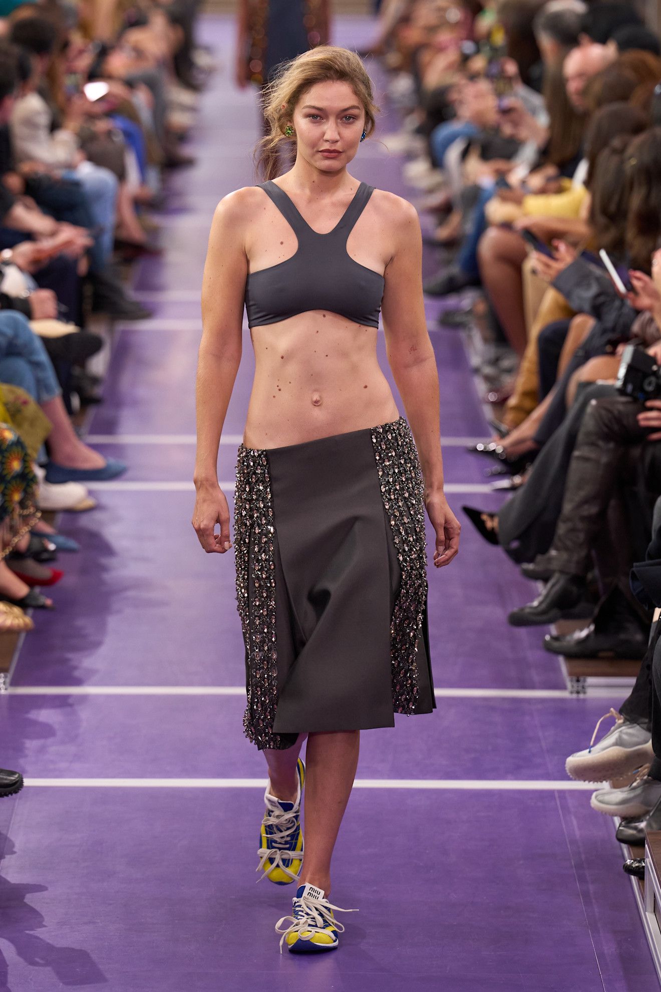 Spring/summer 2027 model wearing a bra top on the runway during fashion month.