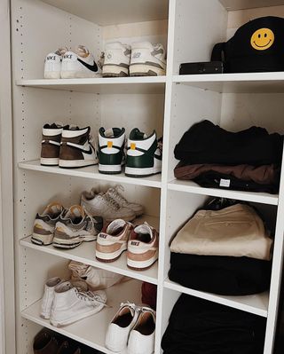 A minimal closet with several pairs of shoes
