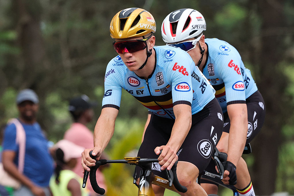 Belgian rider Remco Evenepoel (L) competes in the men&#039;s Elite road race cycling event during the UCI 2025 Road World Championships, in Kigali, on September 28, 2025. (Photo by Anne-Christine POUJOULAT / AFP)
