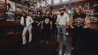 Whiskey Myers standing in a bar