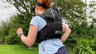 Woman wearing Silva Strive Light Black 10 running pack