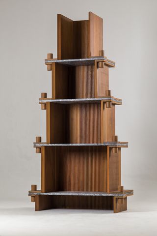 Tall shelving unit made of wood by Cristián Mohaded