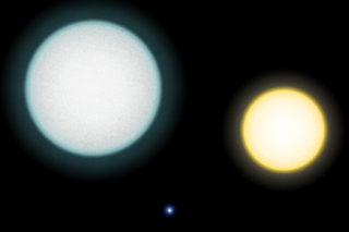 The star on the left shrinks and becomes the white dwarf in the middle of the image. On the right is our own sun, for comparison.