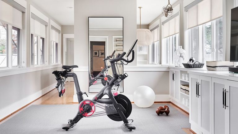 A small home gym area in a bright neutrally-decorated home