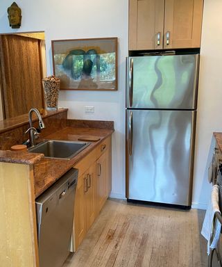Large silver fridge in traditional kitchen