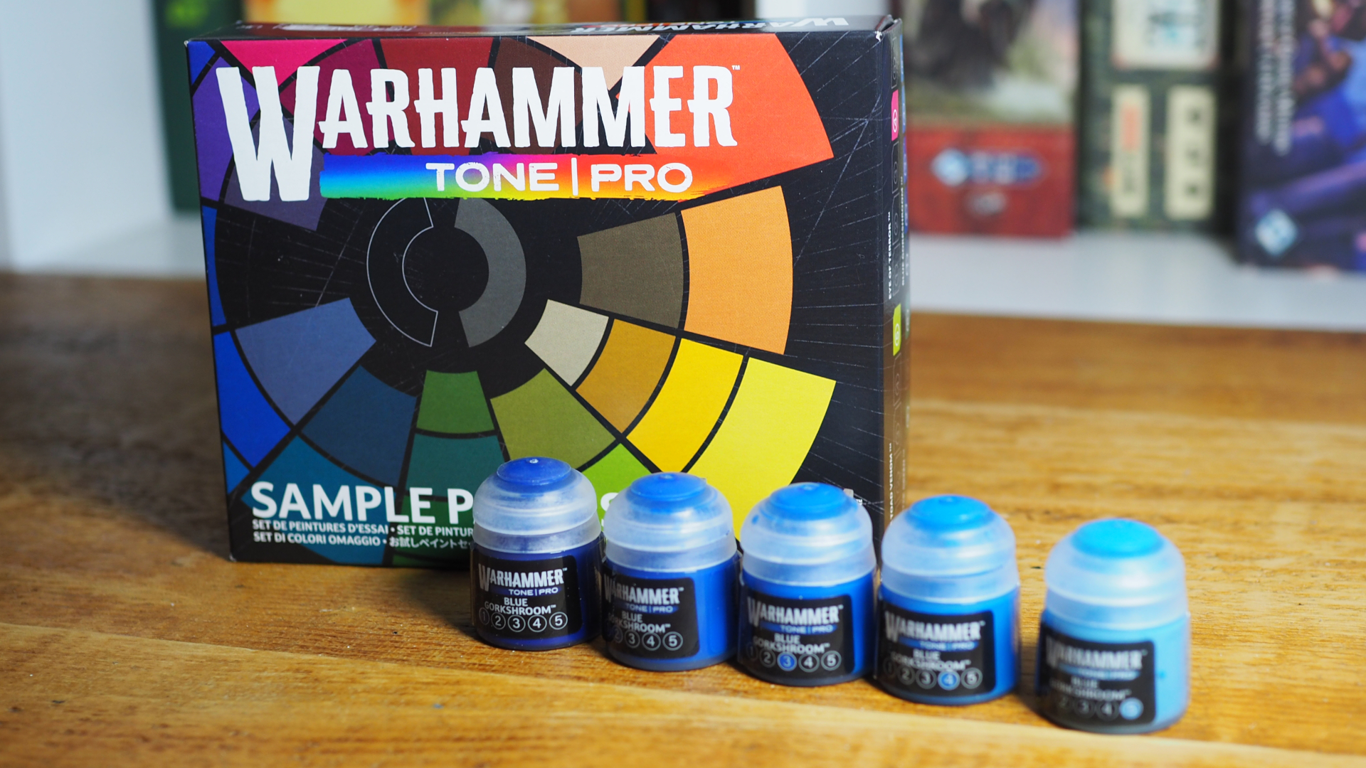 Warhammer Tone Pro paint and box on a wooden surface