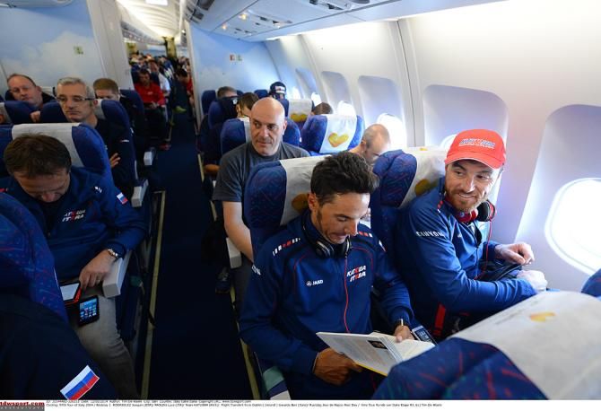 Luca Paolini enjoys his window seat and quietly reading row partner, Joaquim Rodriguez