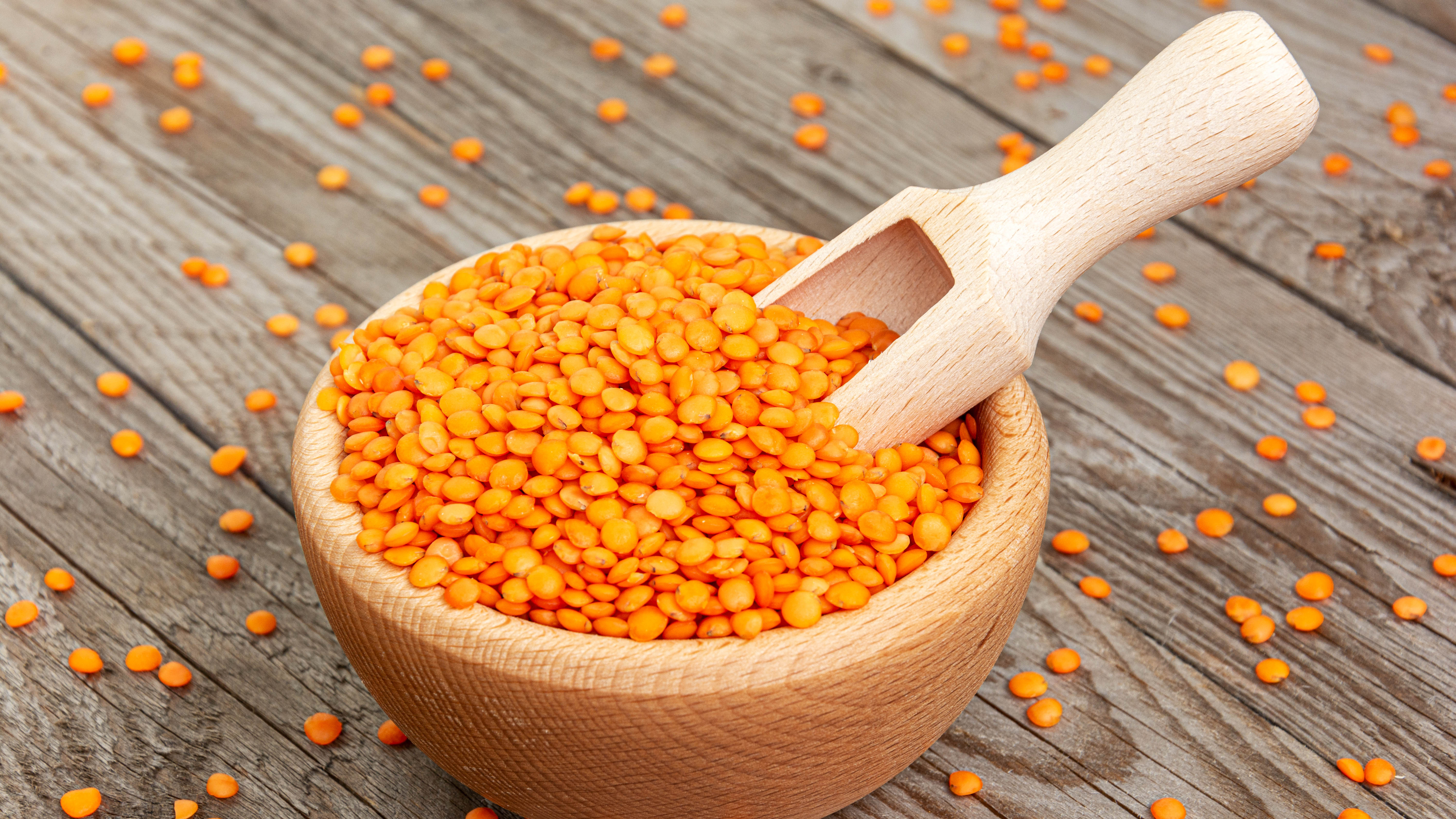 Red lentils in a wooden bowl