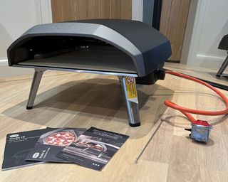 An unboxed Ooni Koda 16 pizza oven on a table
