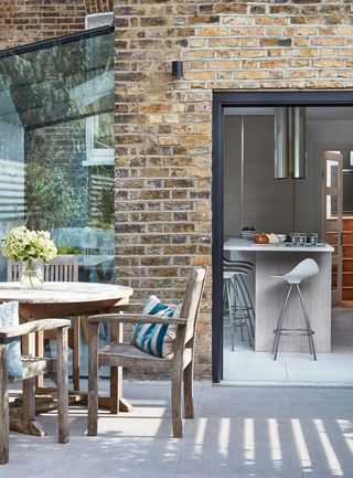 Sarah Brooks kitchen has been improved by adding a glass box style extension to the side of her London home