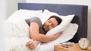 Man sleeping on two pillows