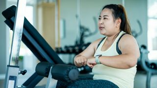 Woman attempting to lose weight at the gym