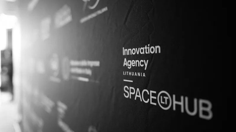A closeup of a sign station Innovation Agency Lithuania by SpaceHub, Lt.
