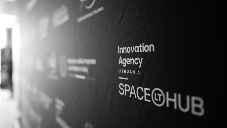 A closeup of a sign station Innovation Agency Lithuania by SpaceHub, Lt.