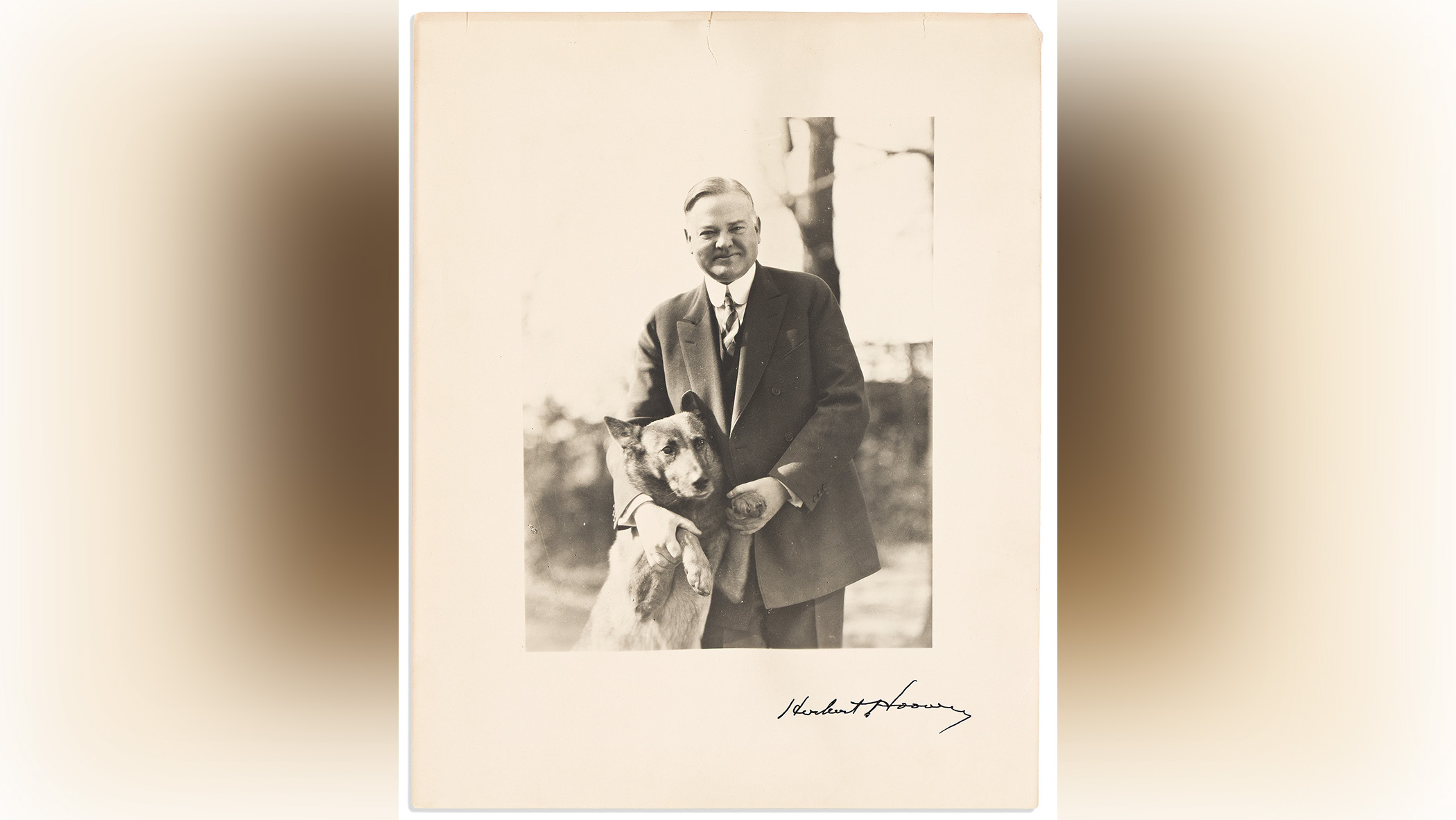 Portrait of Herbert Hoover and his dog King Tut.