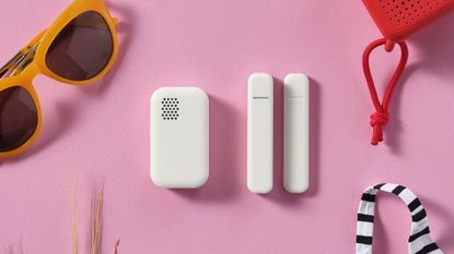 IKEA's new smart sensors together against a pink background