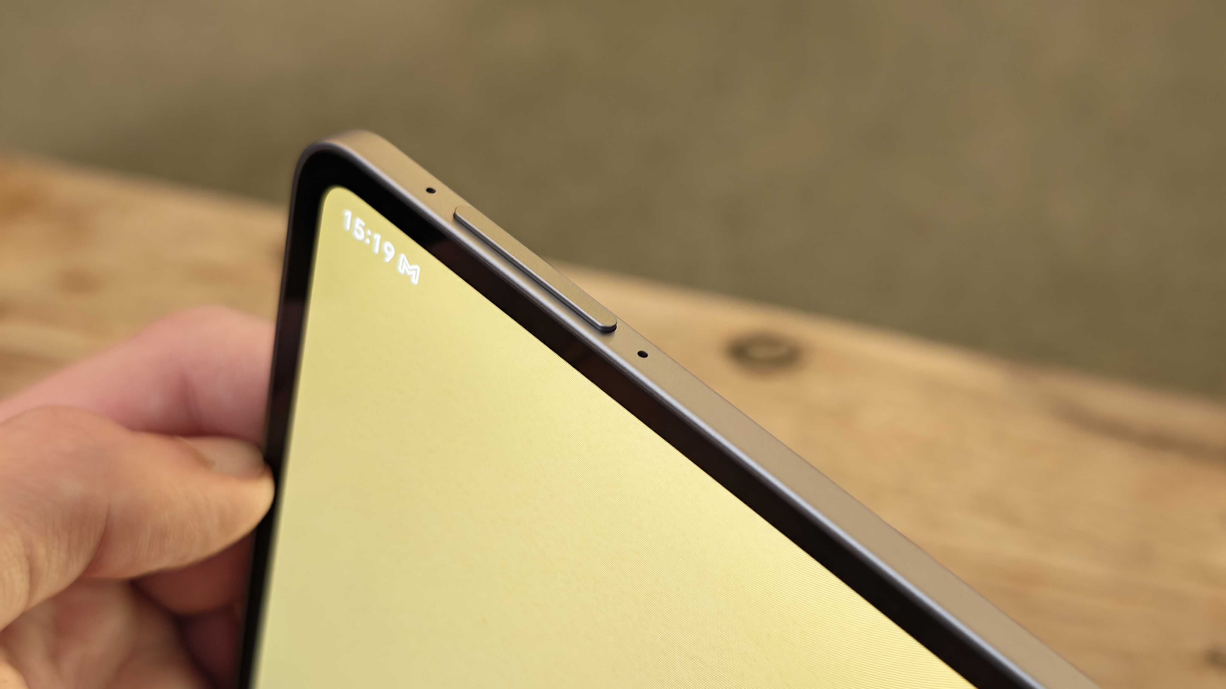 A photograph of the Honor MagicPad 4 in use on a wooden table.