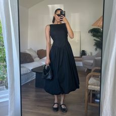 woman in mirror wearing summer outfits 