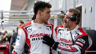 (L-R) Archie Madekwe as Jann Mardenborough and David Harbour as Jack Salter in "Gran Turismo"