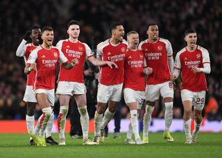 Liverpool will have to beat Arsenal's Ben White, Declan Rice, William Saliba, Oleksandr Zinchenko, Gabriel Magalhaes and Kai Havertz of Arsenal celebrate the 1st penalty save in the shoot out during the UEFA Champions League 2023/24 round of 16 second leg match between Arsenal FC and FC Porto at Emirates Stadium on March 12, 2024 in London, England. (Photo by David Price/Arsenal FC via Getty Images)