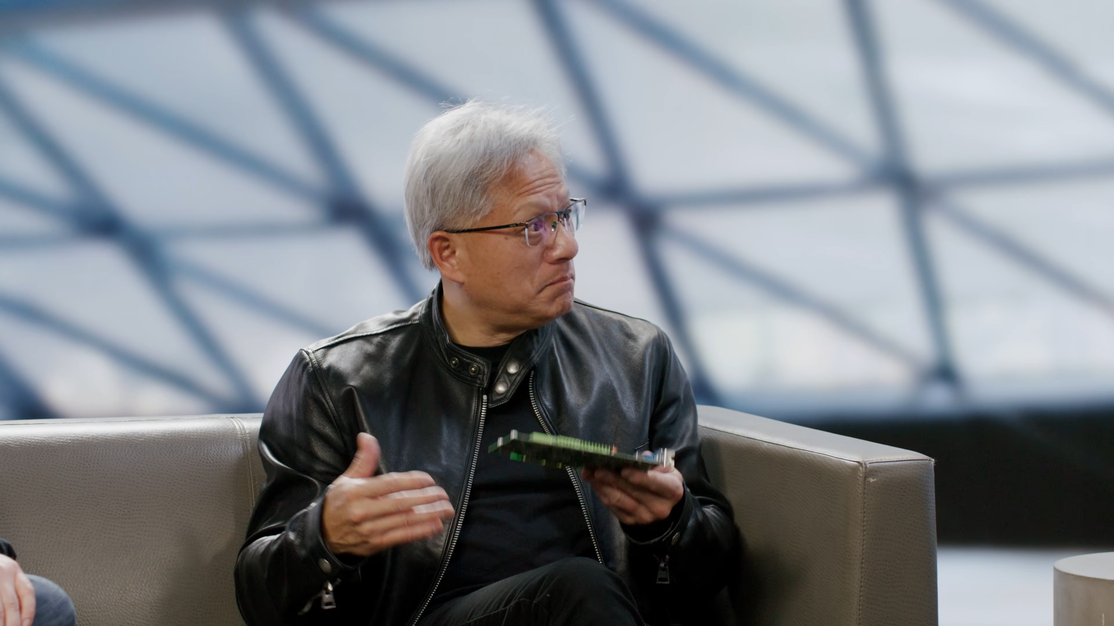Nvidia's Jensen Huang holding a GeForce 3