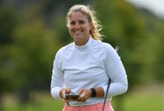 Female golfer smiling 