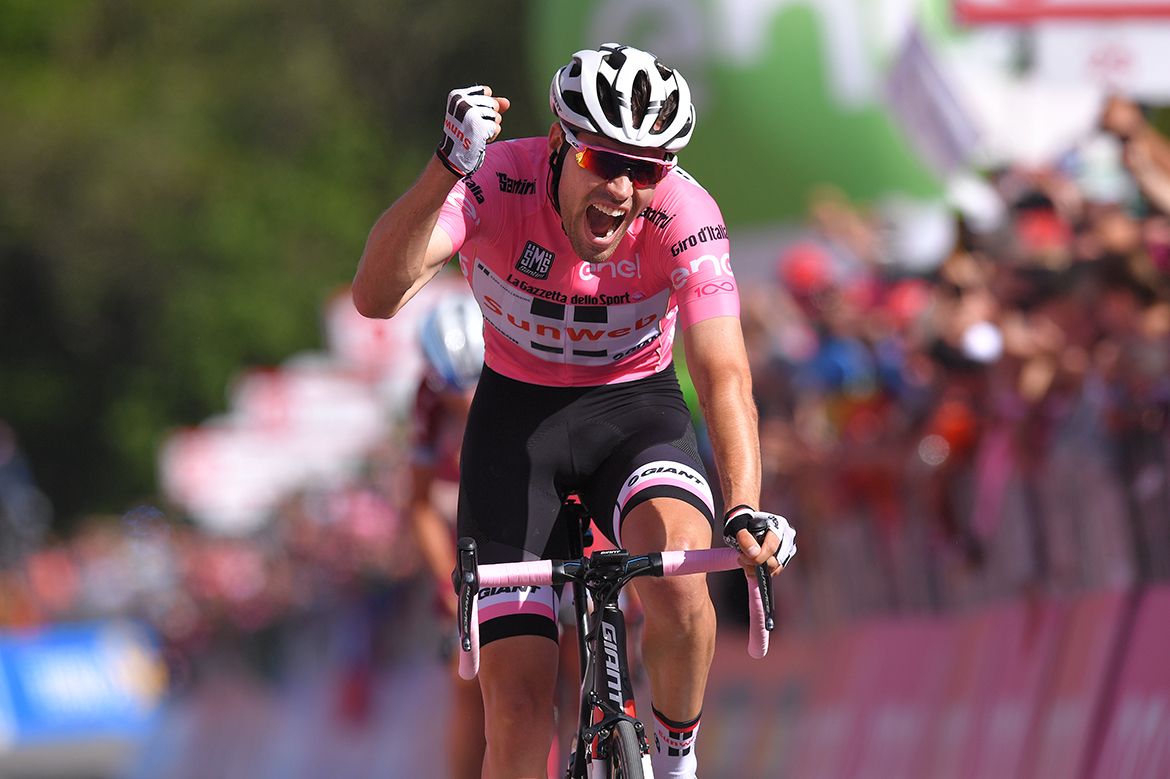 Tom Dumoulin triumphs atop the Oropa climb to extend his Giro d'Italia race lead.