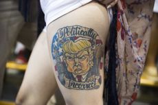 Jennifer Pitta, of Scranton, Pa., shows off a tattoo of Republican presidential candidate Donald Trump during a campaign rally at Lackawanna College