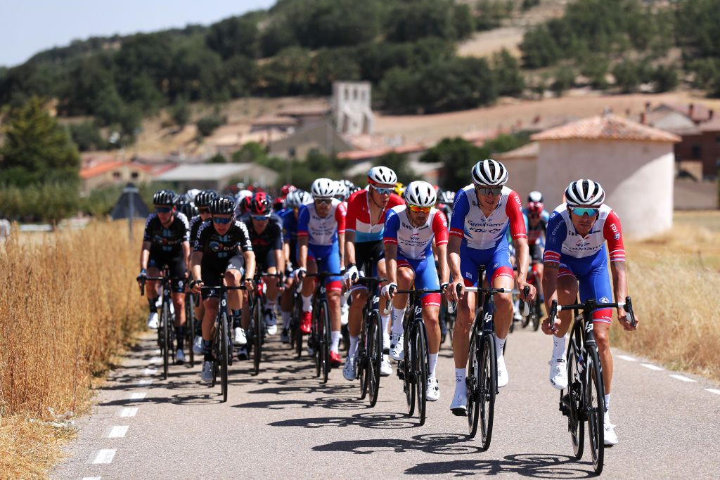 BURGOS SPAIN AUGUST 15 LR Anthony Roux of France and Team Groupama FDJ leads The Peloton during the 76th Tour of Spain 2021 Stage 2 a 1667km stage from Caleruega Monasterio de Santo Domingo de Guzmn to Burgos Gamonal lavuelta LaVuelta21 CapitalMundialdelCiclismo on August 15 2021 in Burgos Spain Photo by Gonzalo Arroyo MorenoGetty Images