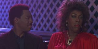 Eddie Murphy as Prince Akeem Joffer and Arsenio Hall as a woman in Coming to America (1988)