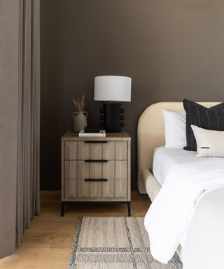 Modern side table in taupe painted bedroom