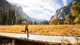 is heel striking bad for you? A woman jogging a boardwalk in Yosemite