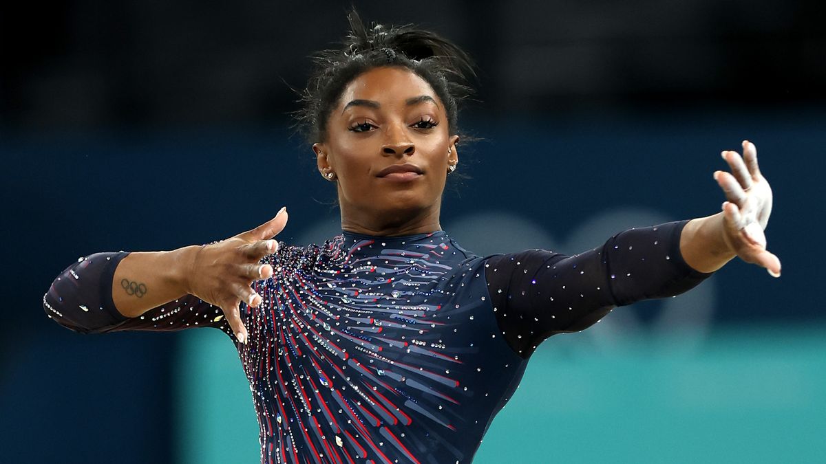 Close-up of Simone Biles, in her navy blue Team USA leotard, at the 2024 Paris Olympics Games