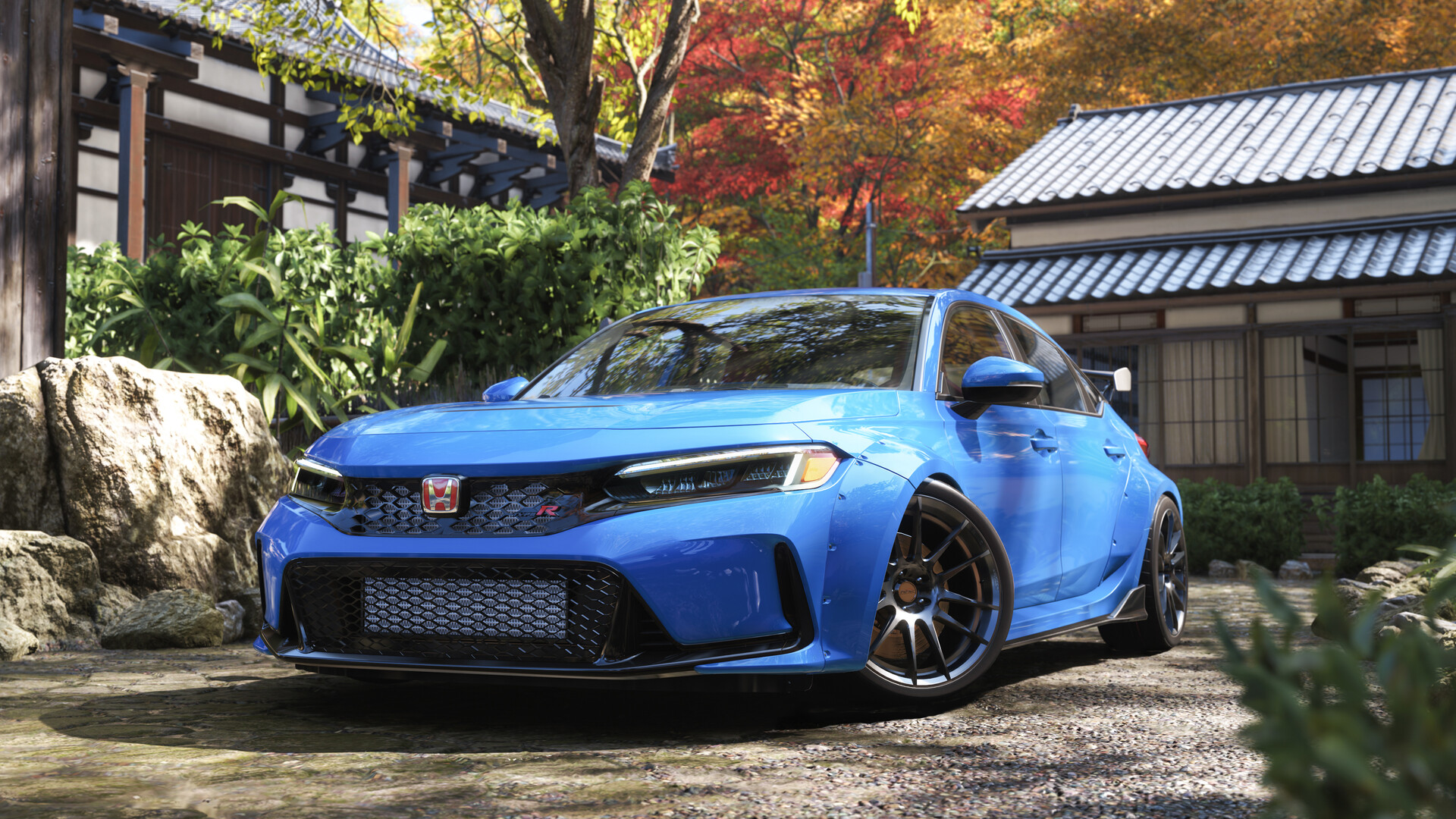 A bright blue Honda sits outside a traditional Japanese building in autumn in Forza Horizon 6.