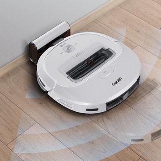 wooden flooring with robot vaccum cleaner on white color