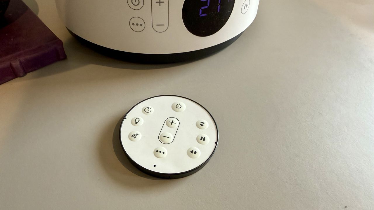 The MeacoFan Sefte Pro 10" Table Air Circulator remote control pictured on a grey table