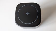 UGREEN Uno 2-in-1 Magnetic Wireless Charger 15W that supports Qi2 on a white table.