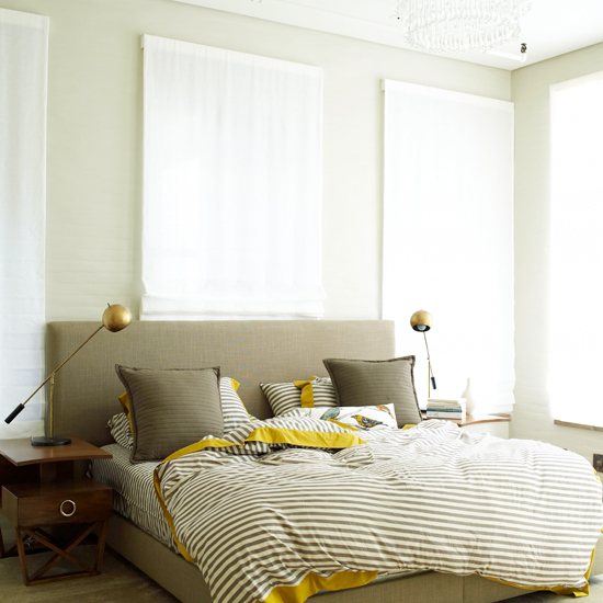 master bedroom with table lamps and bedside table