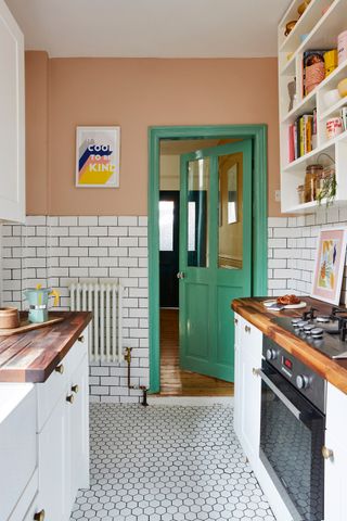 galley kitchen with green door and door frame