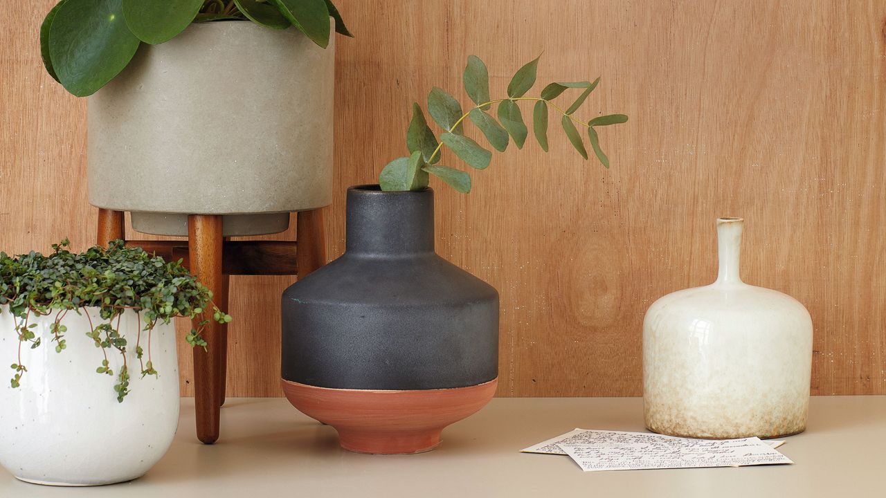 Vases and planters displayed on tabletop