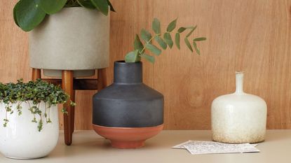 Vases and planters displayed on tabletop
