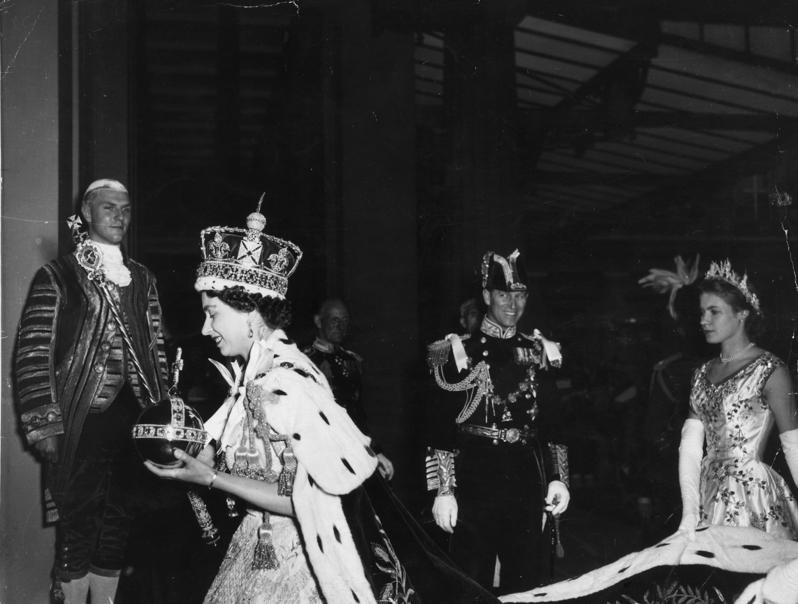 Queen Elizabeth wearing the Imperial state crown and carrying an orb and sceptor after her coronation