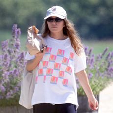 Mary-Kate Olsen wears free city sweatpants, flip-flops and a graphic tee.