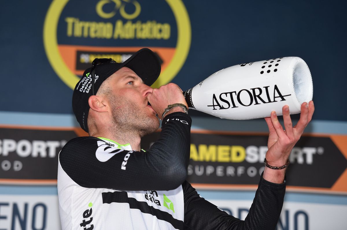 Stephen Cummings (Dimension Data) sips the winners Astoria