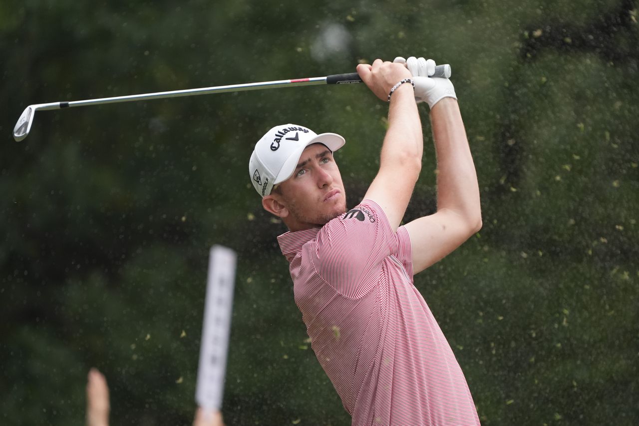 Tom McKibbin hits an iron shot
