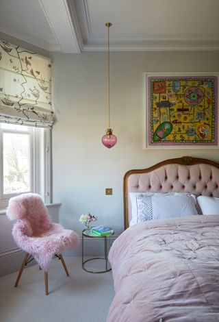 Traditional pink bedroom with velvet upholstered headboard