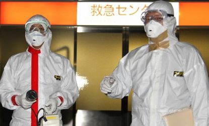 A doctor conducts radiation tests for those who might have been exposed during explosions at Japan's damaged nuclear power plant.