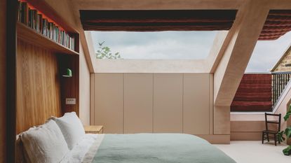 Loft bedroom with huge skylight, built-in headboard with shelving