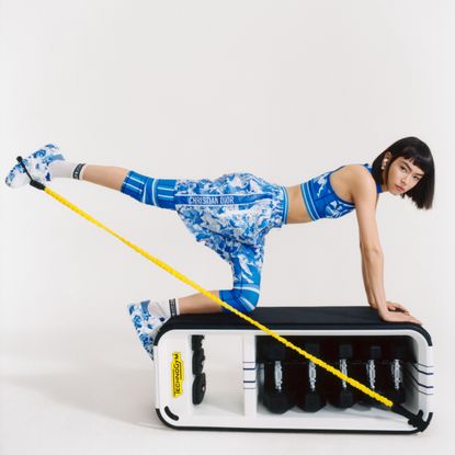 Woman working out in bright blue activewear